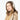 Cream braided knit Barts Browniez earmuffs worn by woman in coat