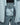 Open light blue Mammut jacket internal waist adjustment system with snap buttons