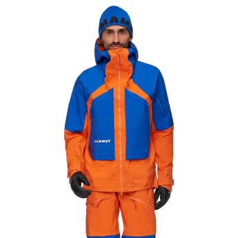 Mammut Eiger Nordwand Pro HS hooded ski jacket blue orange worn with beanie and gloves