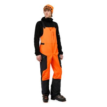 Front view of Mammut Eiger Free Pro HS bib ski pants worn with beanie