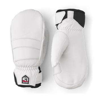 Pair of white Hestra Fall Line Mitts with black cuffs and logo patches