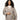 Woman wearing Barts Bugbane leopard print faux fur phone bag over gray wool coat