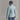 Women's light blue ORTOVOX down jacket back view with high collar