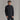 Smiling man wearing black quilted stand-up collar jacket