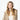 Woman modeling cream Barts faux fur earmuffs with ribbed turtleneck