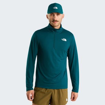 The North Face men's teal 1/4 zip performance top close up with white logo