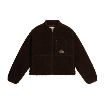 Flat-lay of brown The North Face cropped full-zip fleece jacket with curved flap pocket and interior tag