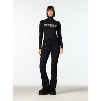 Woman wearing black Goldbergh slalom ski pants with quilted knees and front zippers