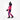 Walking shot of Goldbergh Sansu women's gradient pink purple blue black ski suit with fur hood