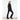 Back view of woman in black Goldbergh Meave ski outfit with glossy panel pants and Salomon boots