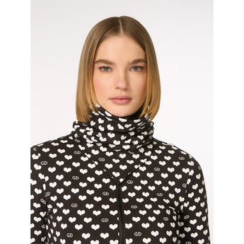 Model wearing black Goldbergh Cupid Neckwarmer as high collar over zip-up top