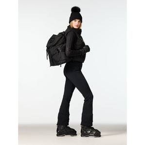Woman wearing black Goldbergh Bijou quilted backpack in winter gear side profile