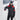 Man wearing black Stöckli ski jacket with red sleeve details in snowy mountain setting