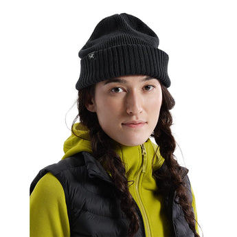 Black Arcteryx Mallow Toque medium close-up with animal logo tag