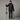 Man holding skis wearing The North Face Chakal Pant M black with insulated jacket for winter sports