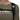 Black Mammut strap detail on olive t-shirt showing logo and buckle