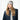 Light gray ribbed headband worn on forehead by model in turtleneck