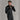 Man wearing slim fit black Ortovox fleece jacket with high collar