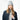 Woman wearing light gray Barts Witzia ribbed knit beanie with folded cuff