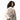 Cream faux fur handbag with green heart tassel accessory