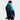 Hiker wearing The North Face Basin 15 black backpack with trekking poles in hand