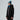 Woman wearing The North Face Descendit Jkt W black ski jacket with hood up and blue beanie