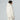 Side profile of woman in The North Face Descendit Jkt W cream ski jacket with hood up