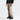 Side profile of beige The North Face Chakal snow pants with black leg panels