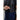 Close-up of navy pants with striped black suspenders and high waist fit
