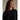 Three-quarter profile of Arcteryx fleece crewneck highlighting ribbed collar and fabric texture