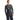 Male model showing fit of Arcteryx Rush navy bib ski pants with hand near thigh pocket