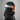 Salomon Husk Pro matte black ski helmet worn with orange mirrored goggles